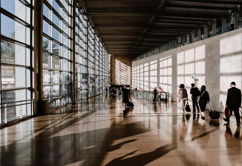 A bustling trvael centre with people moving